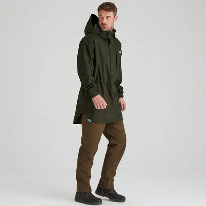Man wearing ridgeline monsoon light green hooded smock and brown pants outdoors