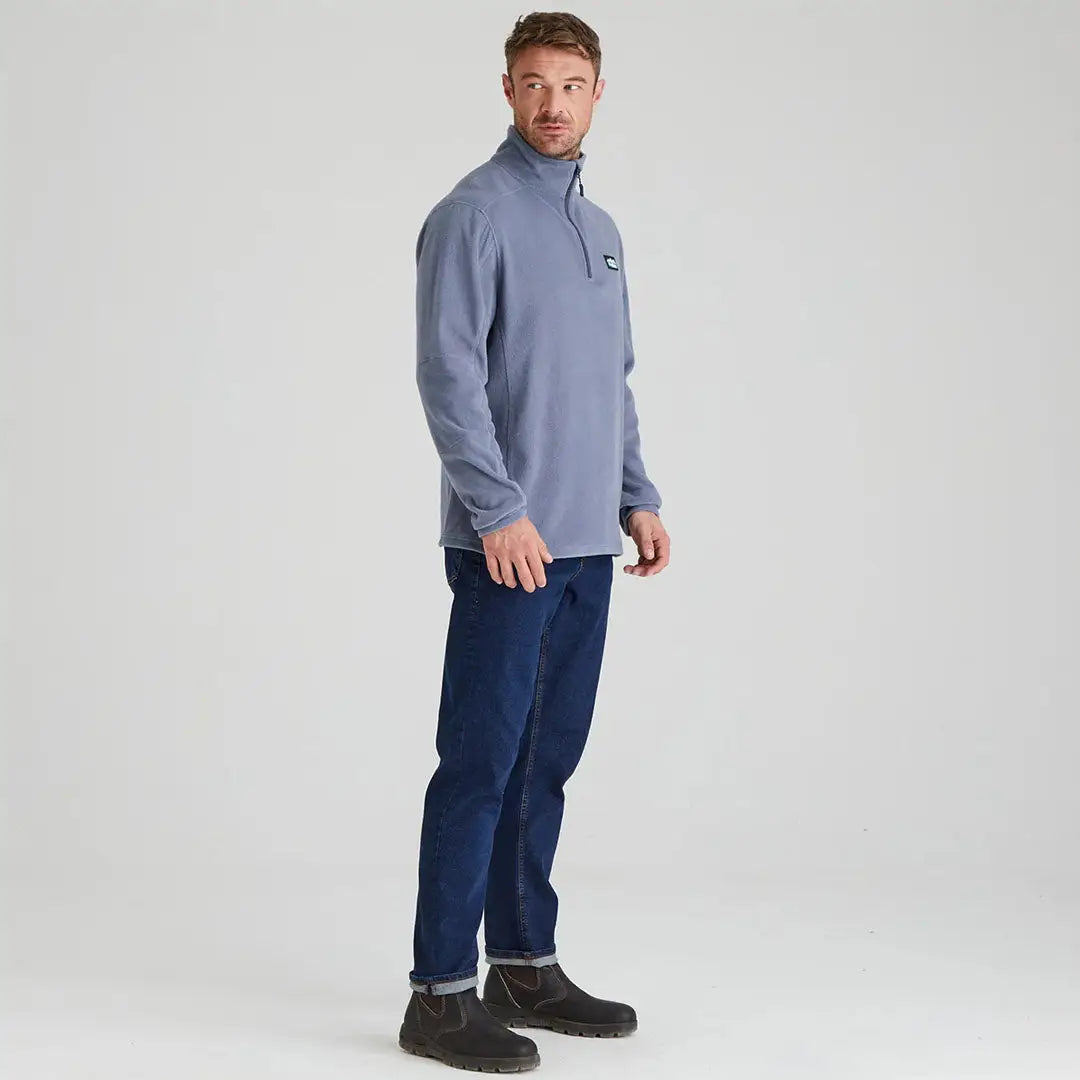 Man in a blue Ridgeline Narvik Fleece made from functional polyester fleece and jeans