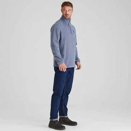 Man in a blue Ridgeline Narvik Fleece made from functional polyester fleece and jeans