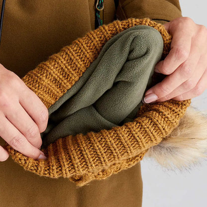 A cozy Ridgeline Nordic Fleck Bobble Hat with fleece lining and faux fur pom-pom