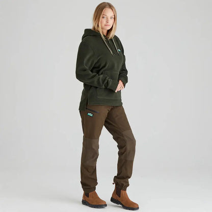 Woman wearing ridgeline womens ballistic hoodie in dark green with brown pants and boots