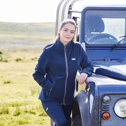 Woman in navy Brenna Fleece Jacket by Ridgeline, perfect for country hunting trips