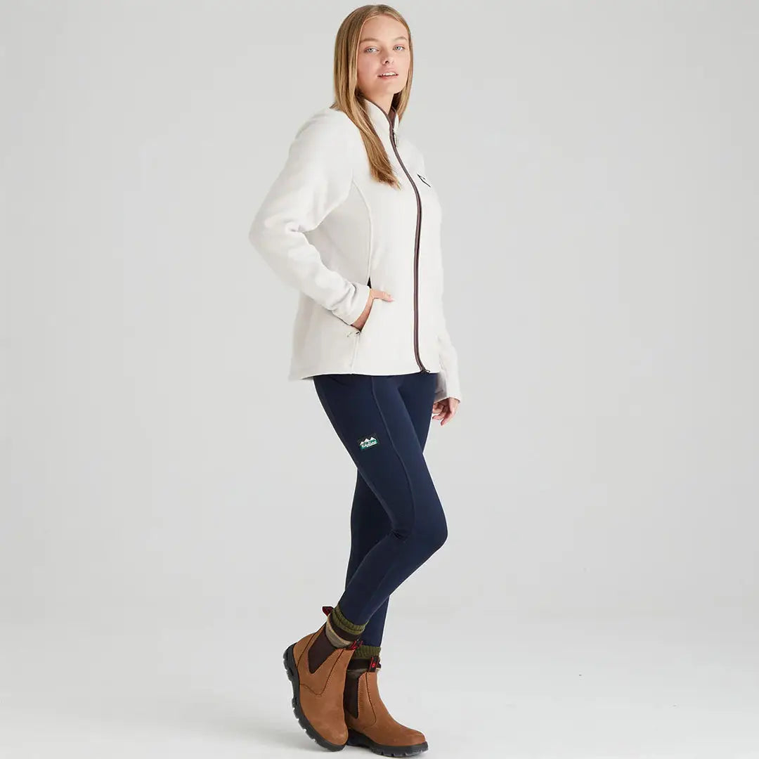 Woman wearing a Breanna Fleece jacket in cream, perfect for country hunting style