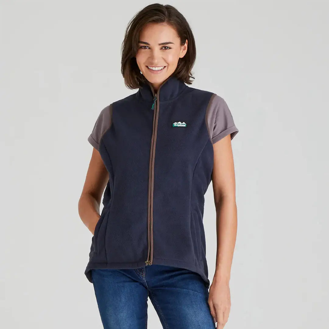 Woman wearing navy blue Ridgeline Womens Kodiak Gilet for outdoor adventures