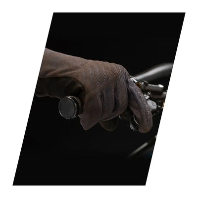 Hand in a leather Sealskinz Howe Glove gripping a motorcycle handlebar for weather multi-activity