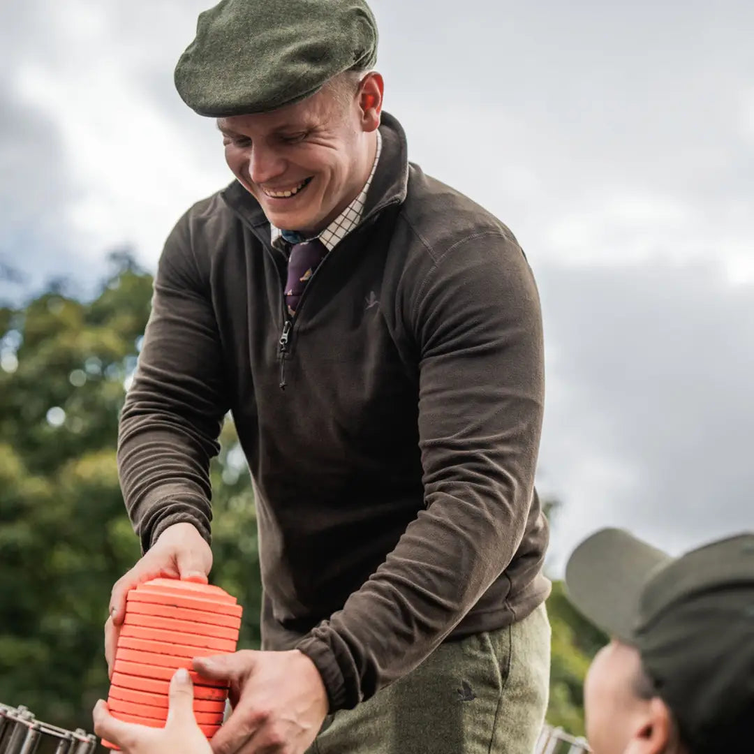 Orange clay targets on Seeland Benjamin Half Zip Fleece for cozy outdoor shooting weekends