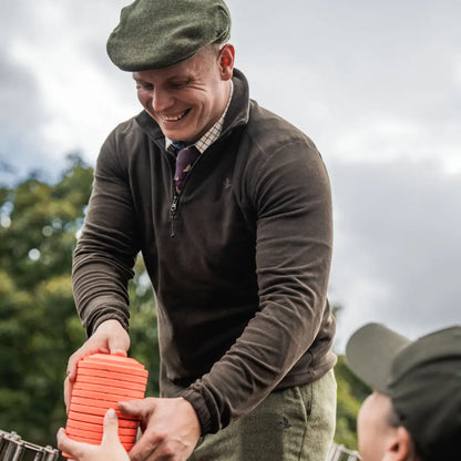Orange clay targets on Seeland Benjamin Half Zip Fleece for cozy outdoor shooting weekends