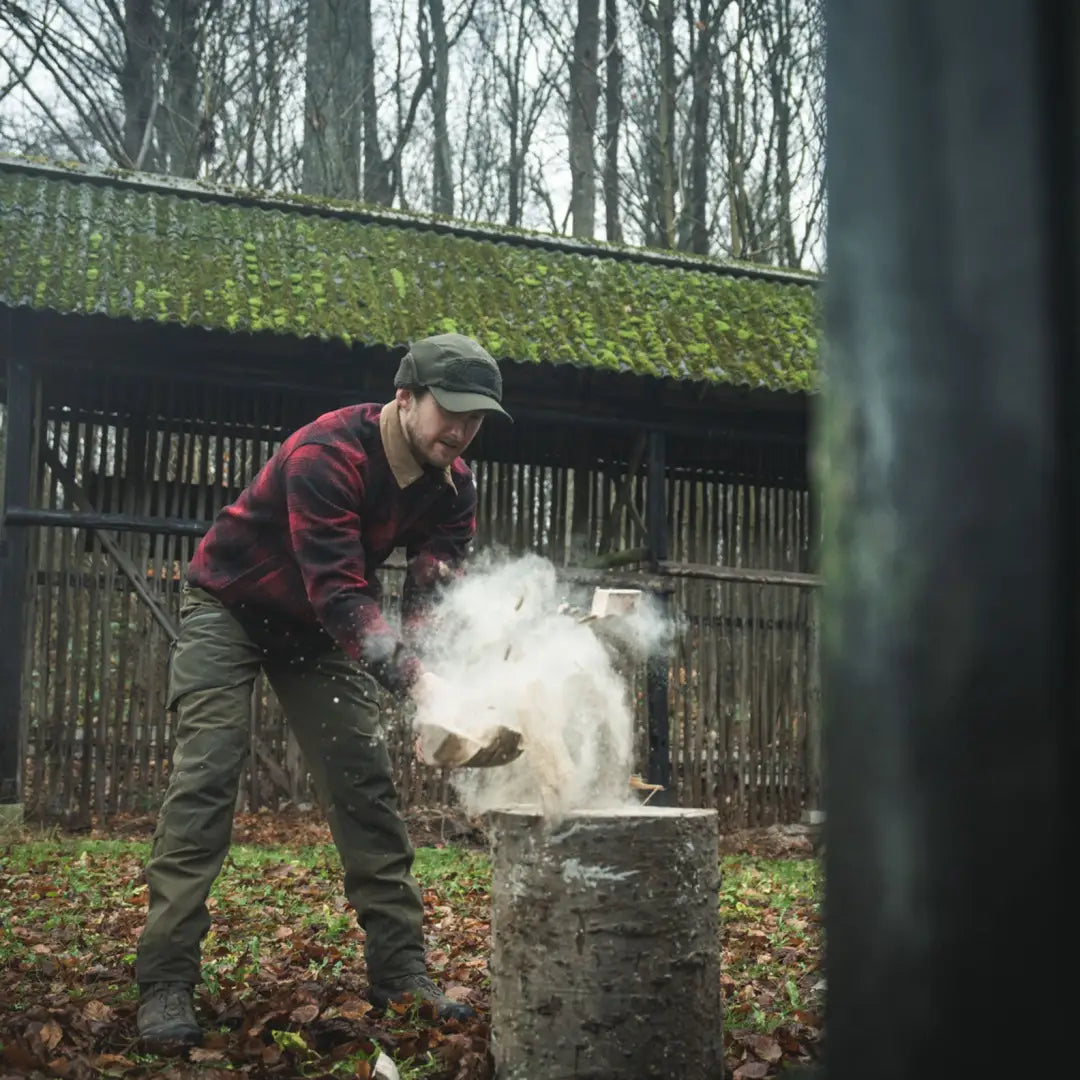 Man chopping wood wearing Seeland Canada Yukon Shirt, perfect Yukon shirt for outdoor work