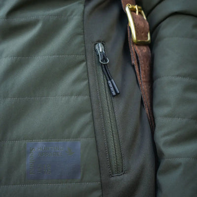 Olive green Celsius Aia heat jacket with quilted design and zipper pocket for women