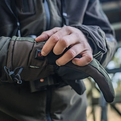 Heated glove with power button showcasing Seeland Celsius Heat Gloves for warm hands
