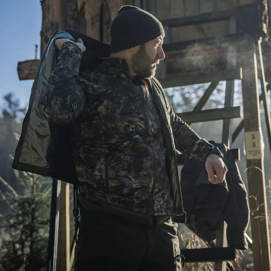 Man in camouflage jacket wearing Seeland Celsius Heat Liner Waistcoat for warmth