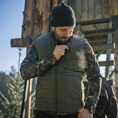 Man in olive green Seeland Celsius Heat Liner Waistcoat showcasing cold weather gear