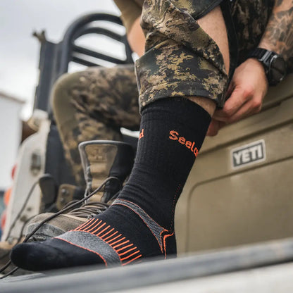 Black sock with orange stripes from Seeland Field Coolmax Sock 2 Pack, perfect for hunting