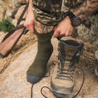Hiking boot with laces for outdoor adventures and country clothing in hunting gear