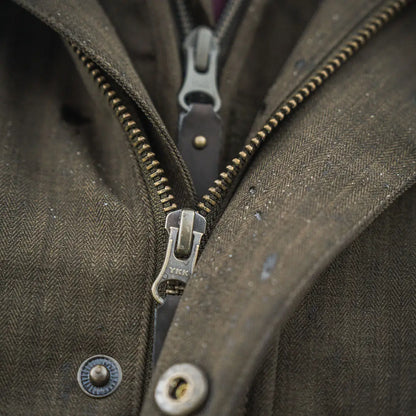 Olive green Seeland Highpoint Jacket with brass zippers, perfect for country hunting style
