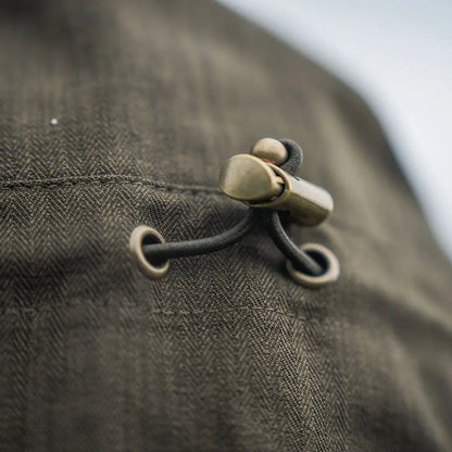 Olive green herringbone fabric with metal toggle on Seeland Highpoint Jacket for hunting and country clothing