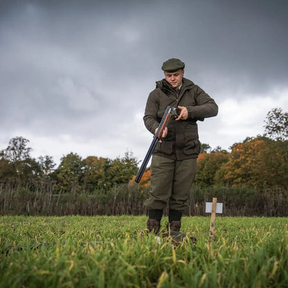 Hunter loading shotgun in Seeland Highpoint Jacket for hunting and country clothing