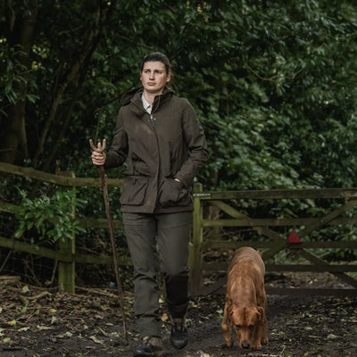 Woman in outdoor country clothing with dog wearing Seeland Highpoint Womens Harriet Jacket for hunting