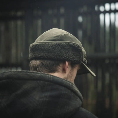 Olive green teddy fold-down cap, perfect trapper hat for outdoor adventures