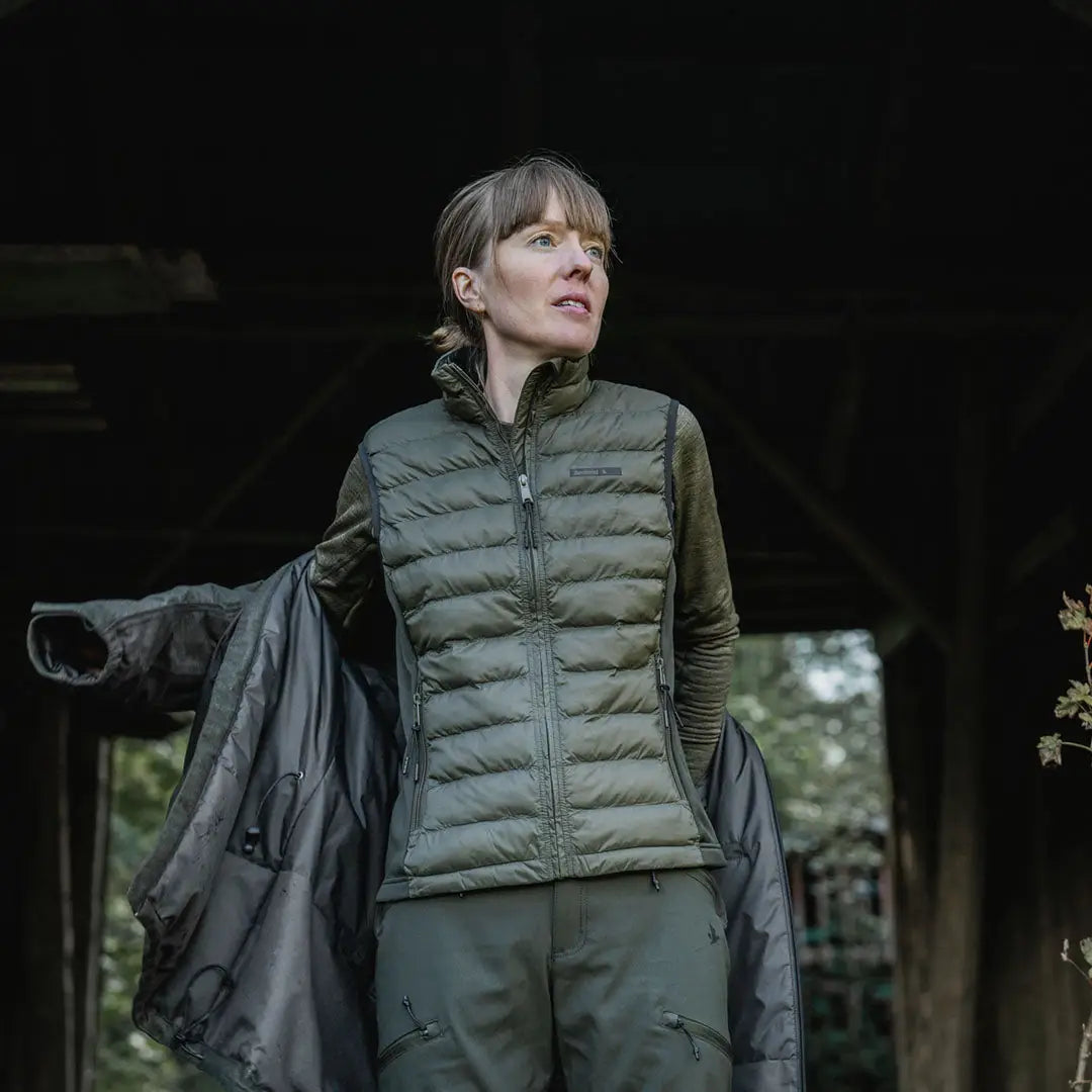 Woman in olive green outdoor clothing wearing Seeland Therma Womens Waistcoat for hunting