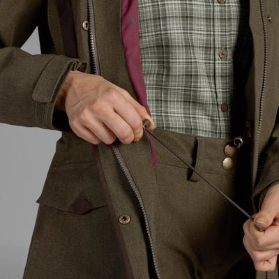 Olive green Waxed Cotton Woodcock Advanced Jacket with plaid shirt underneath