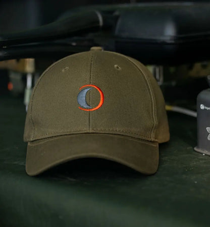 Olive-green Speero Baseball Cap featuring a stylish crescent-moon logo