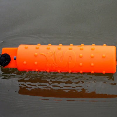 Bright orange Sporting Saint Water Dummy floating in water for fun dog playtime