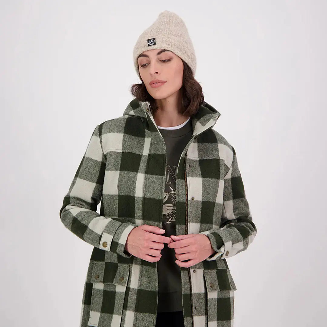 Woman in Swanndri Annmore merino wool overcoat with beanie and checkered hood