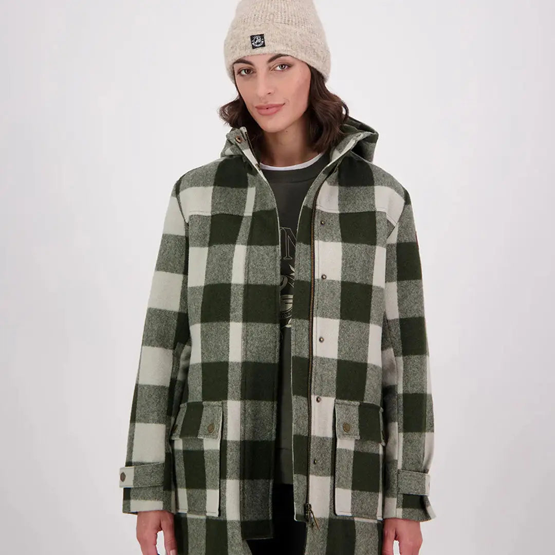 Woman in cream beanie and green plaid Swanndri Annmore merino wool overcoat