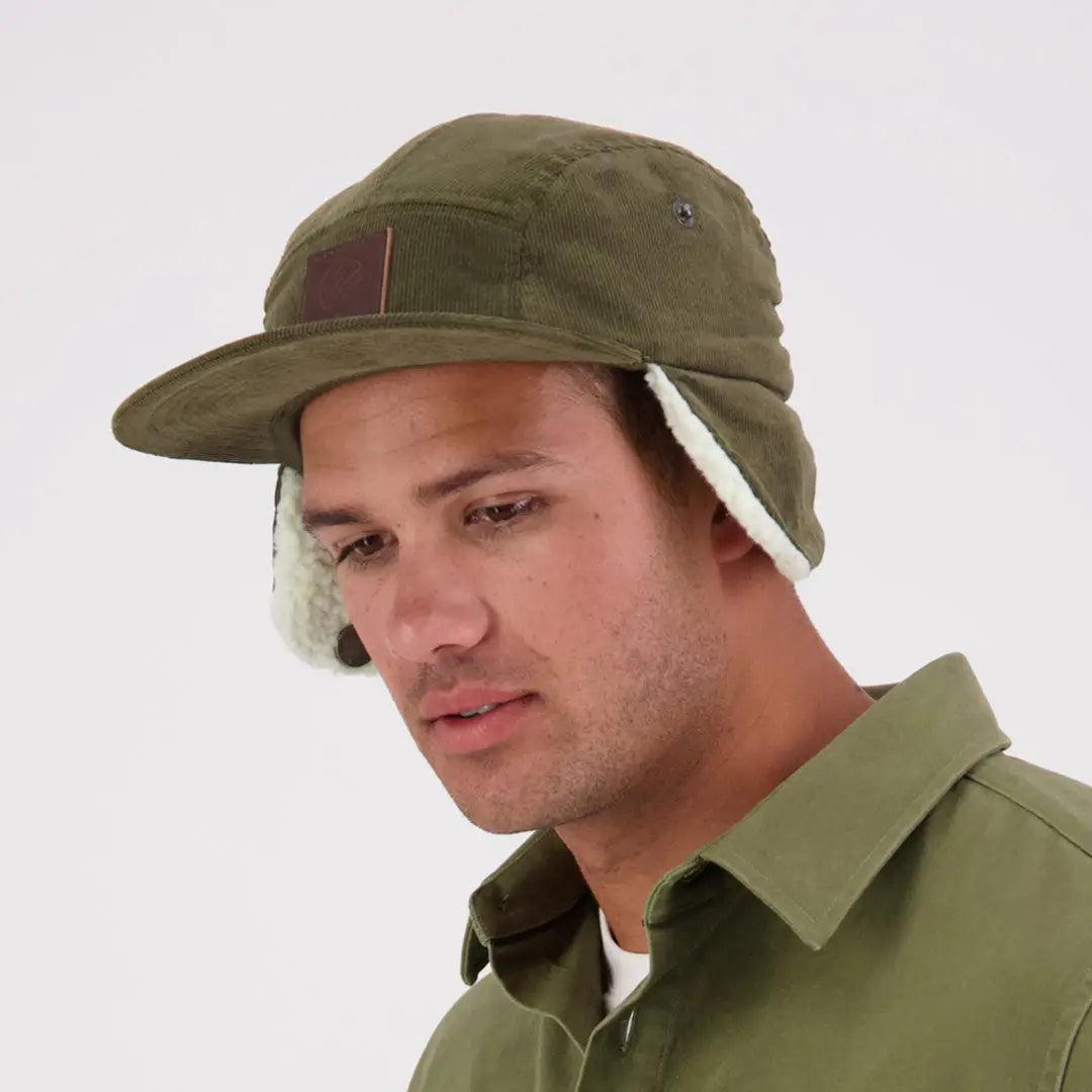 Olive green Swanndri Birchwood Sherpa lined cap with earflaps and faux-shearling lining