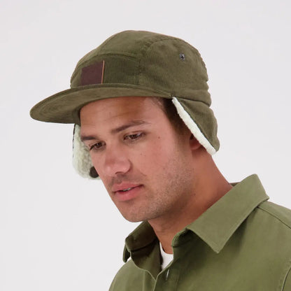 Olive green Swanndri Birchwood Sherpa lined cap with earflaps and faux-shearling lining