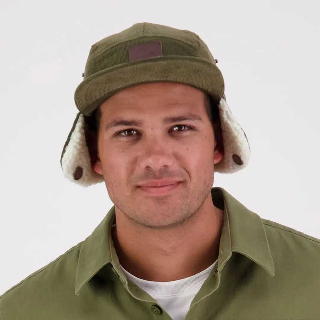 Olive green Swanndri Birchwood Sherpa lined trapper hat with cream faux shearling flaps