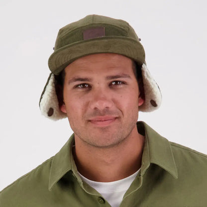 Olive green Swanndri Birchwood Sherpa lined trapper hat with cream faux shearling flaps