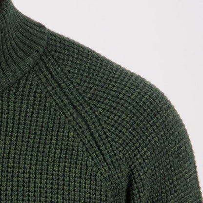Dark green Swanndri Chalky Island waffle jumper with ribbed turtleneck and raglan sleeves