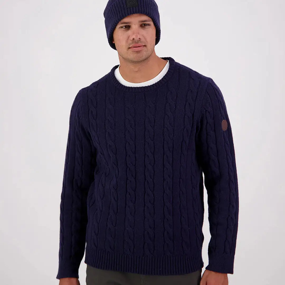 Men’s navy blue Swanndri Doncaster Mens cable knit crewneck sweater with brown patch