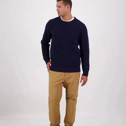 Men’s navy blue Swanndri Fistral Waffle Knit sweater with khaki pants outfit