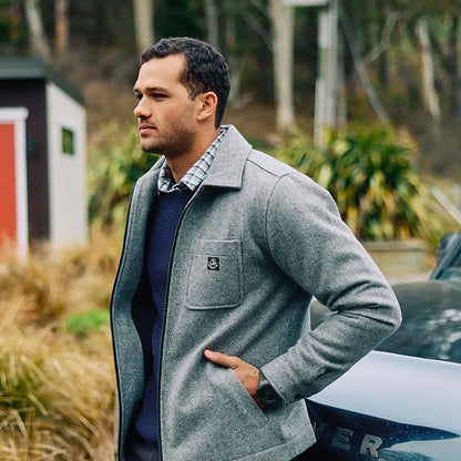 Man in Swanndri Fistral Waffle Knit jacket with plaid shirt and navy sweater