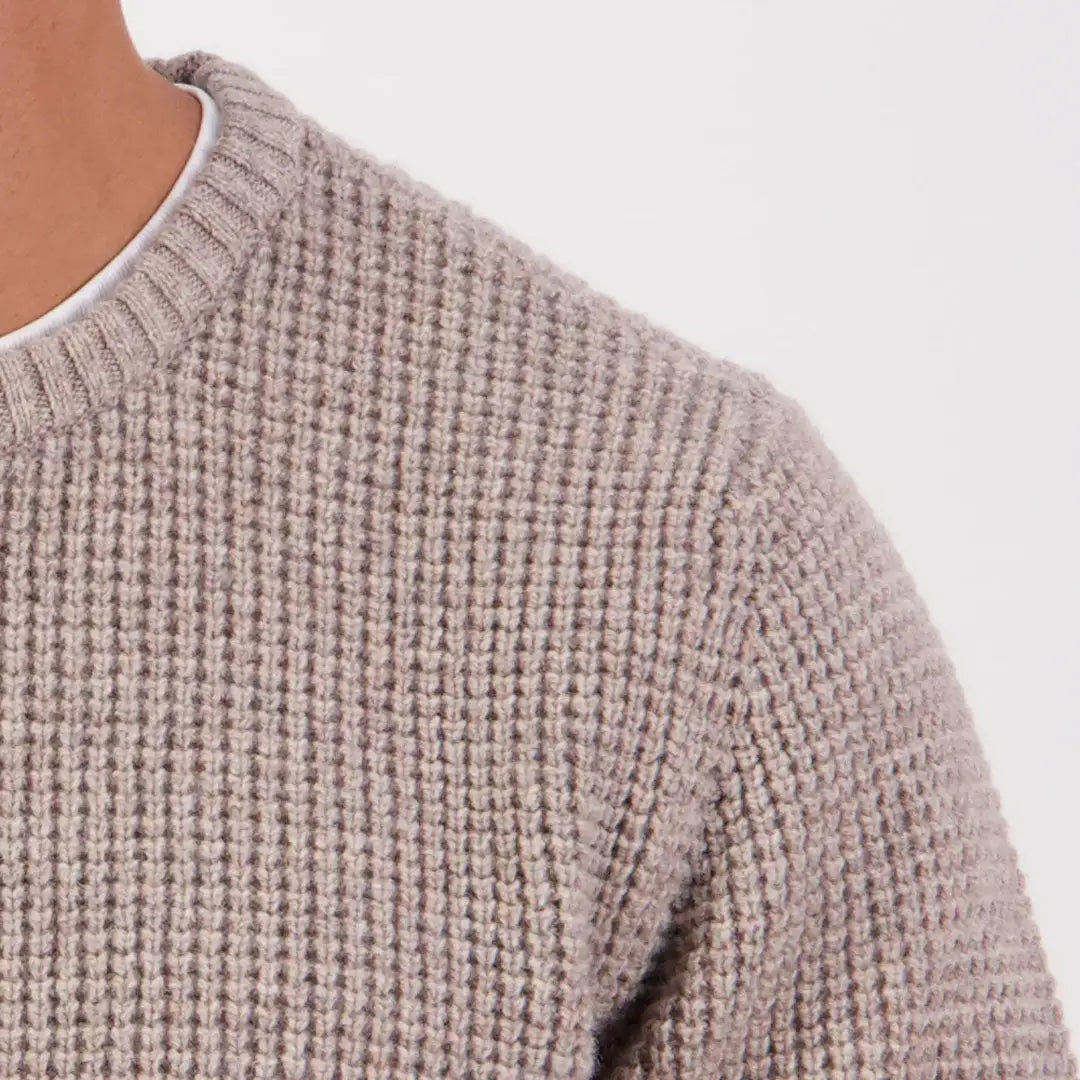Close-up of a person in a swanndri fistral waffle knit chunky sweater with a ribbed crew neck