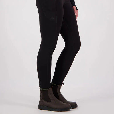 Person wearing black Swanndri High Rock Womens Legging with dark brown Chelsea boots