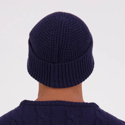 Navy blue knitted Swanndri Newton Beanie with ribbed cuff for cozy winter style