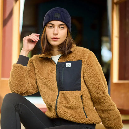 Woman in brown sherpa fleece jacket and black Swanndri Newton Beanie outside