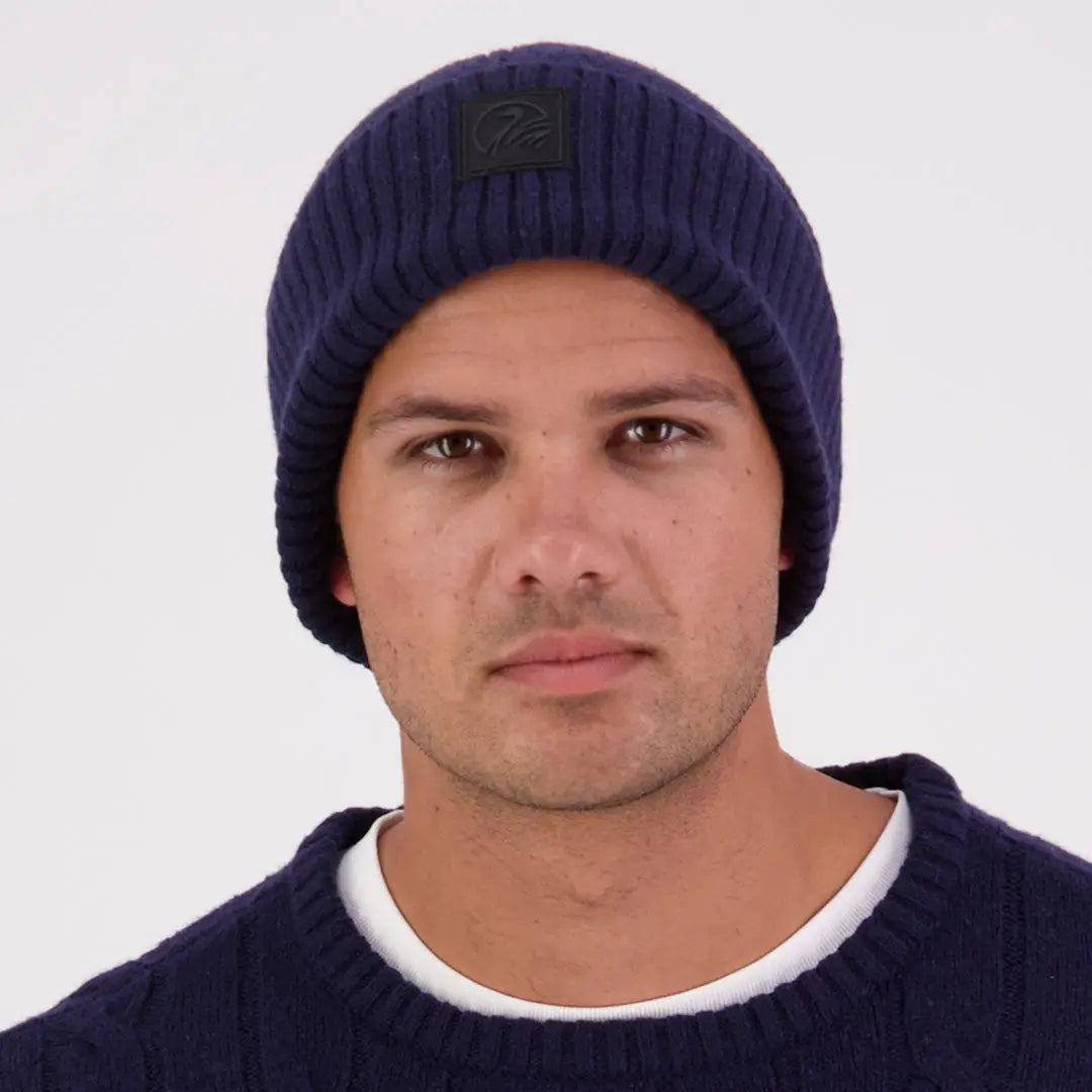 Man wearing Swanndri Newton Beanie and matching sweater in navy blue style