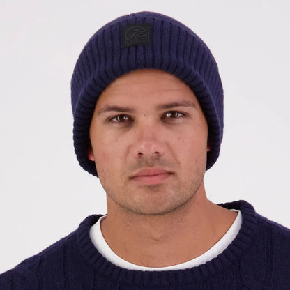 Man wearing Swanndri Newton Beanie and matching sweater in navy blue style