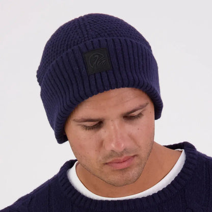 Navy blue Swanndri Newton Beanie with black patch, cozy knit winter hat