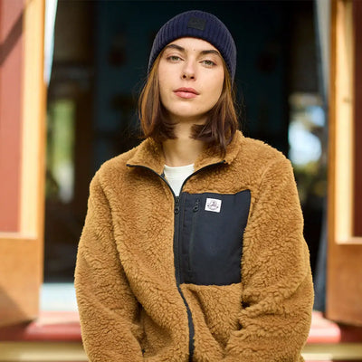 Person wearing Swanndri Newton Beanie and brown sherpa fleece jacket outdoors