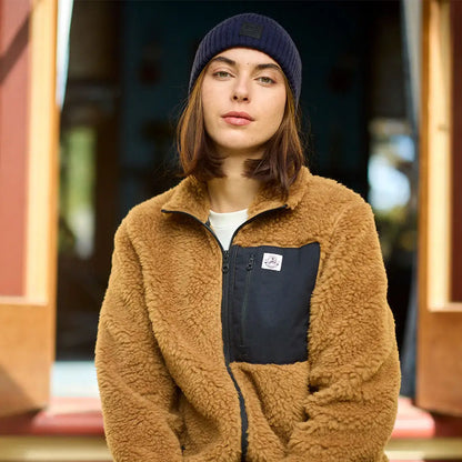 Person wearing Swanndri Newton Beanie and brown sherpa fleece jacket outdoors