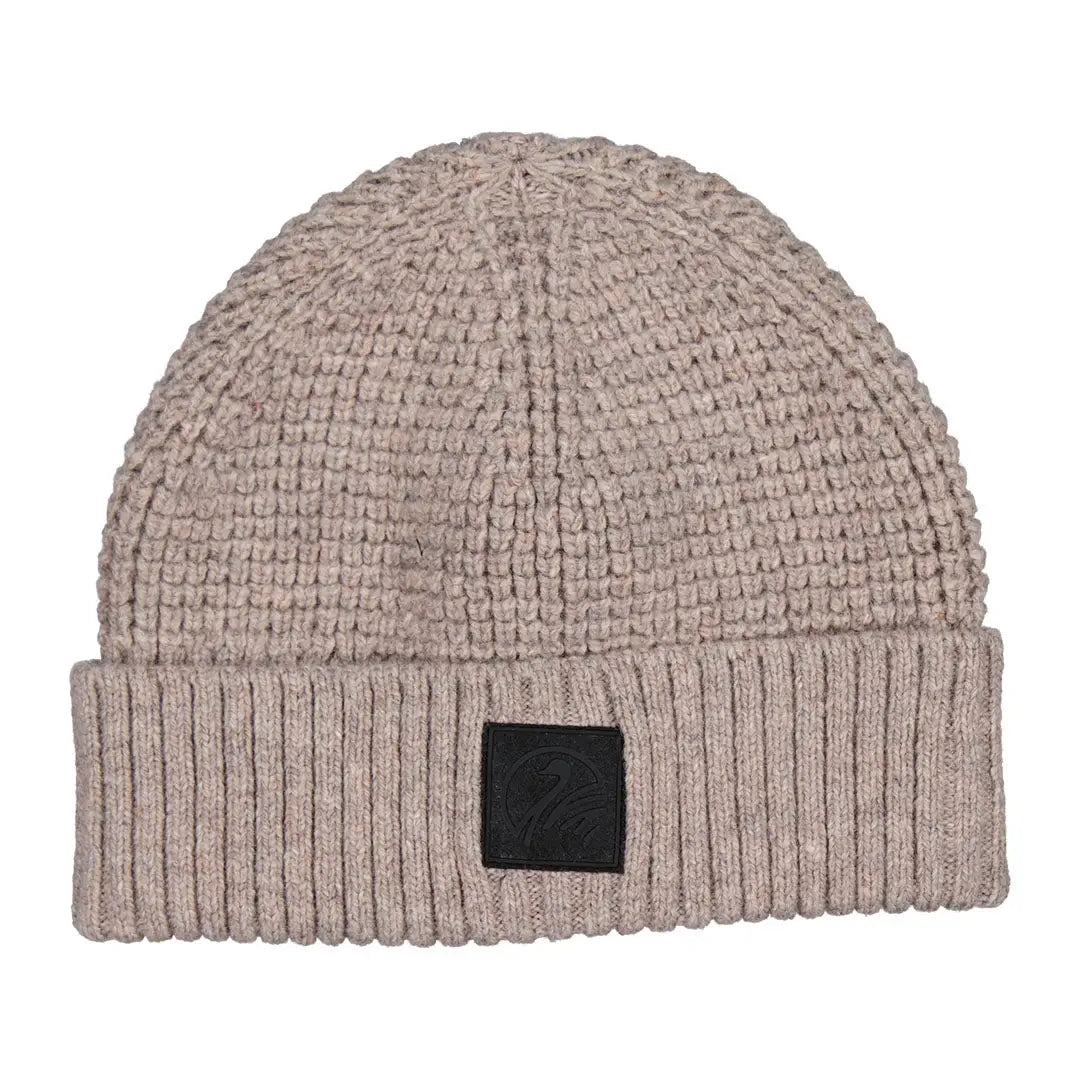 Light brown knitted Swanndri Newton Beanie with black patch, cozy and stylish accessory