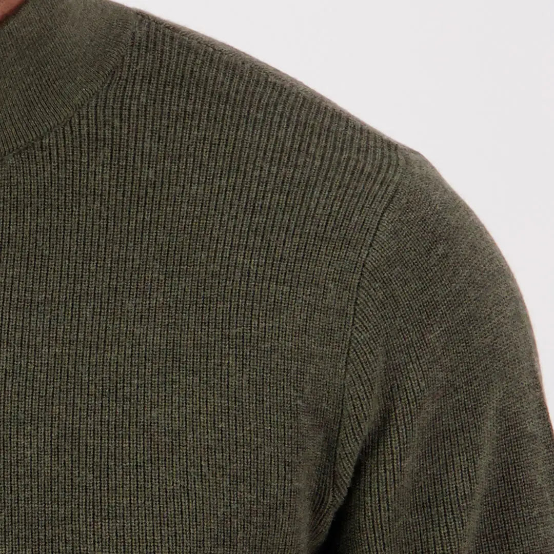 Close-up of dark olive green Swanndri Otahu River quarter zip sweater featuring ribbed knit