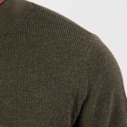 Close-up of dark olive green Swanndri Otahu River quarter zip sweater featuring ribbed knit