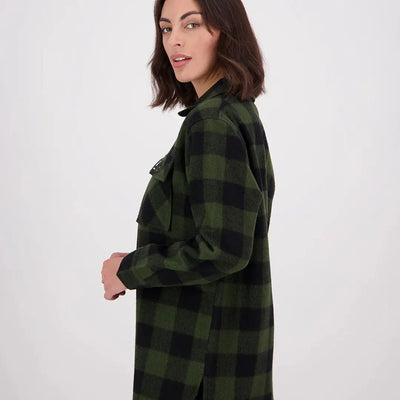 Woman wearing Swanndri Ranger Womens bush shirt in olive green and black plaid flannel